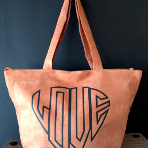 A bag that has the word love written on it.